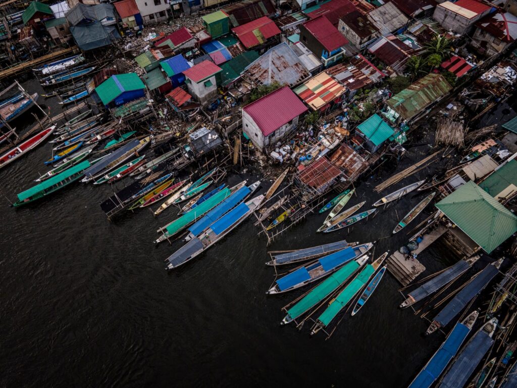 Boats choke the waterfront on Binuangan Island, where the only mode of transportation in or out is by boat. Credit: James Whitlow Delano